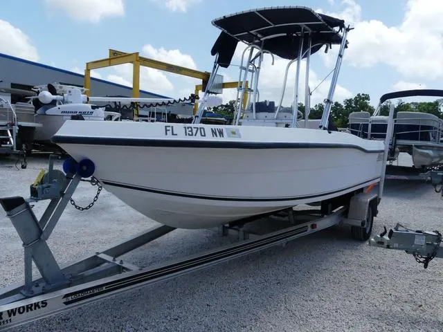 Slide: The Image of 2009 Angler 180 CC boat on trailer in outdoor storage area. - 3