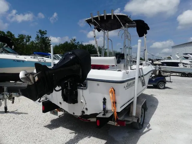 Slide: The Image of 2009 Angler 180 CC boat on trailer, outboard motor, sunny day, parked in marina. - 5