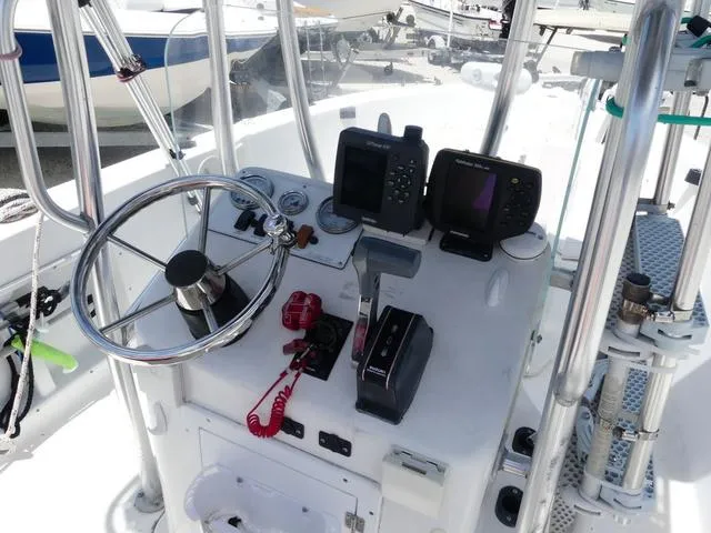 Slide: The Image of 2009 Angler 180 CC boat console with steering wheel, navigation equipment, and controls. - 6