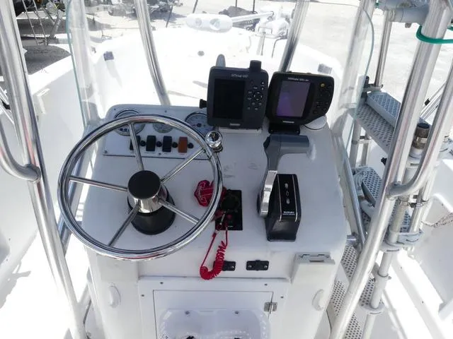 Slide: The Image of 2009 Angler 180 CC boat console with steering wheel and navigation equipment. - 7