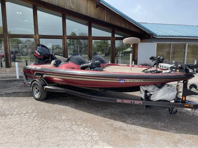 Slide: The Image of 2008 Skeeter ZX190 bass boat parked outside a building. - 1