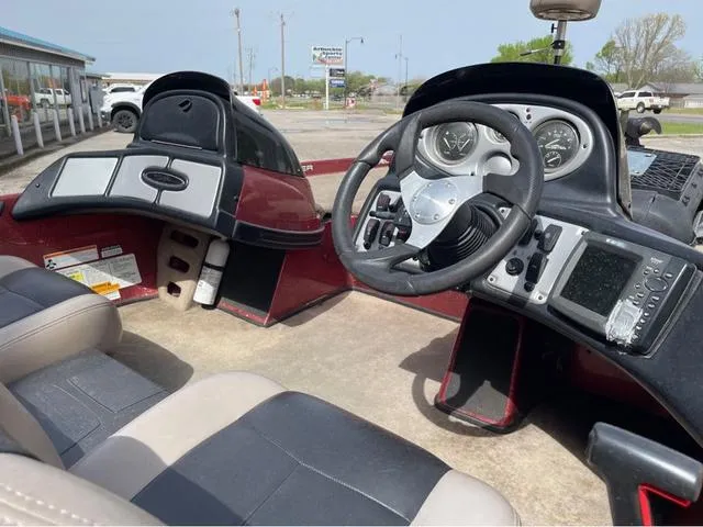 Slide: The Image of 2008 Skeeter ZX190 boat interior with steering wheel and dashboard controls. - 11