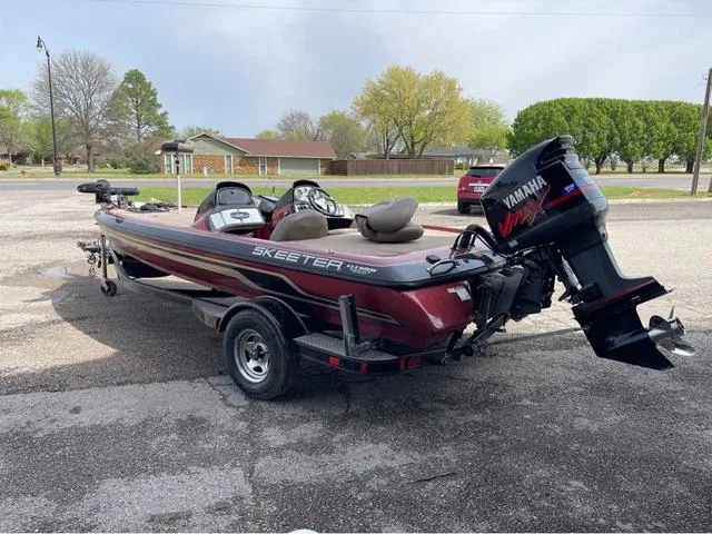 Slide: The Image of 2008 Skeeter ZX190 boat with Yamaha engine parked outdoors. - 5