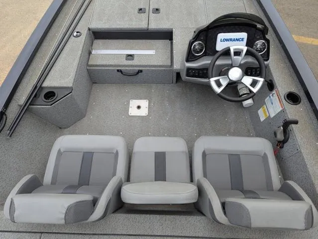 Slide: The Image of 2022 G3 Sportsman 1710 boat interior with steering wheel and seating arrangement. - 26