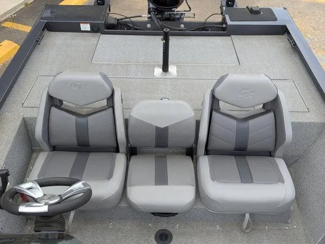 Slide: The Image of 2022 G3 Sportsman 1710 boat interior with three gray seats and steering wheel. - 27