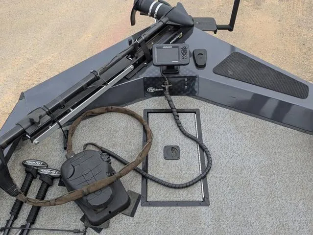 Slide: The Image of 2022 G3 Sportsman 1710 boat deck with fishing gear and electronic equipment. - 28