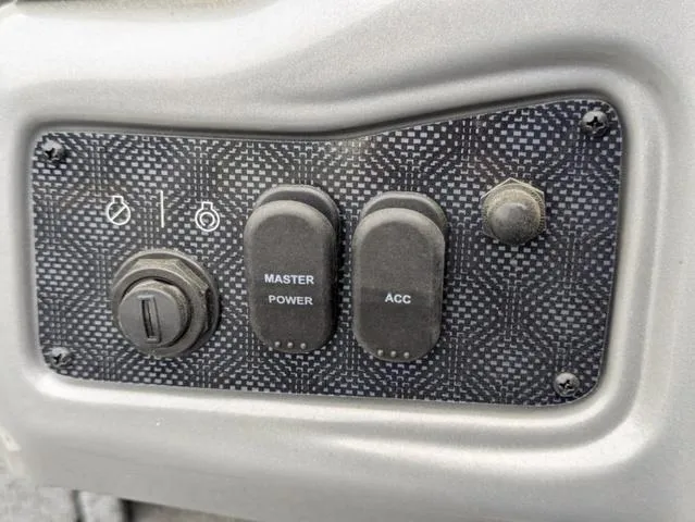 Slide: The Image of Control panel of 2022 G3 Sportsman 1710 with power switches and accessory port. - 38