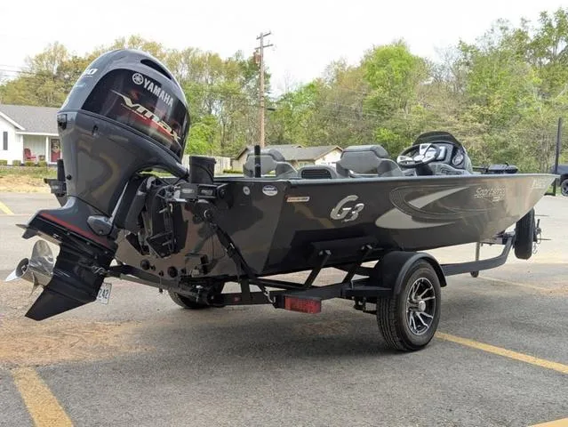 Slide: The Image of 2022 G3 Sportsman 1710 boat with Yamaha engine, parked outdoors. - 6