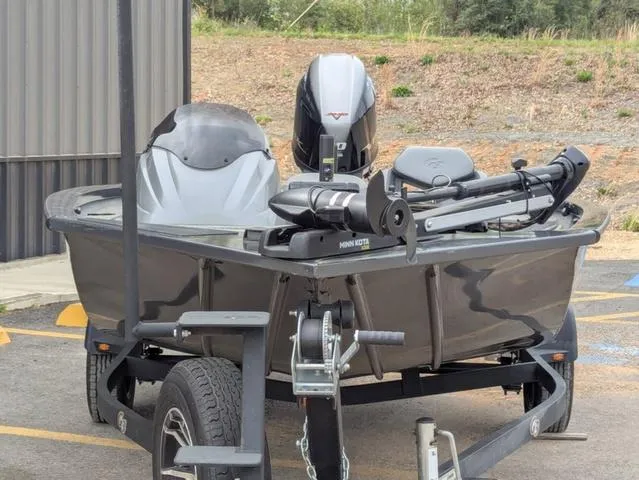 Slide: The Image of 2022 G3 Sportsman 1710 boat on trailer, equipped with motor and fishing gear. - 9