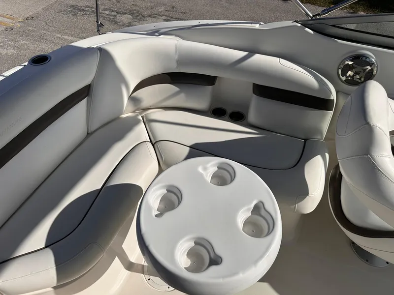Slide: The Image of 2012 Hurricane SD2400 OB boat interior with white seating and cup holders. - 11