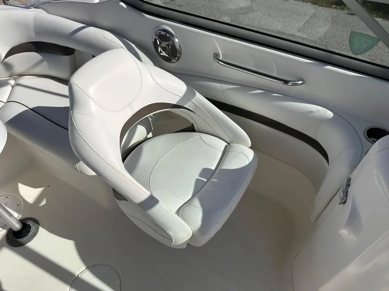 Slide: The Image of 2012 Hurricane SD2400 OB boat interior with white seating and sleek design. - 13