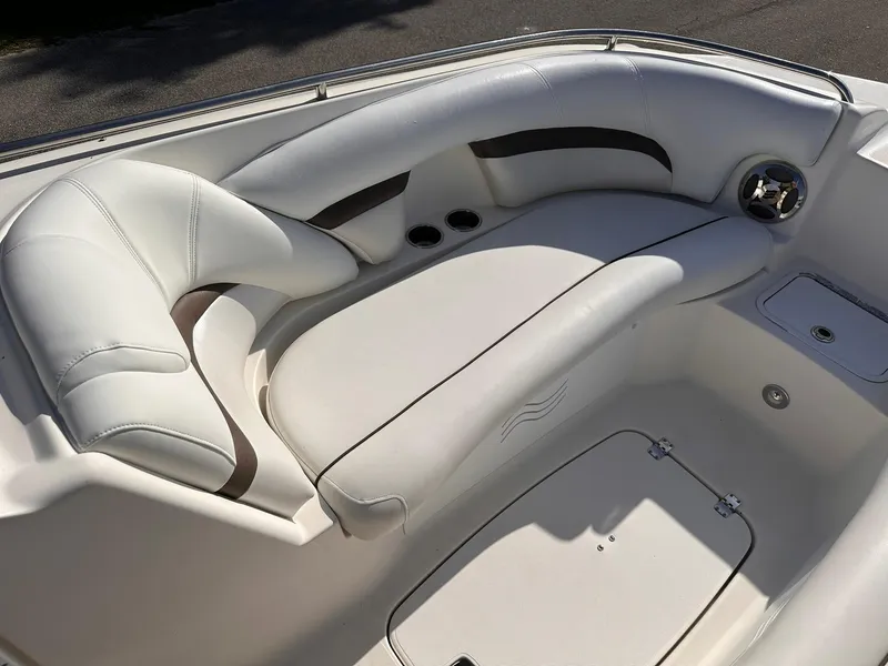Slide: The Image of 2012 Hurricane SD2400 OB boat interior with white cushioned seating. - 18