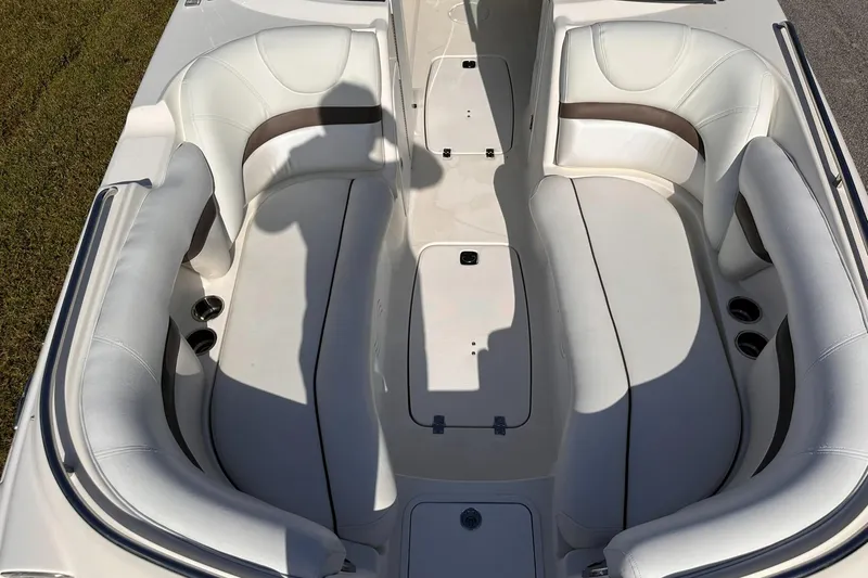 Slide: The Image of 2012 Hurricane SD2400 OB boat interior with white seating and cup holders. - 20