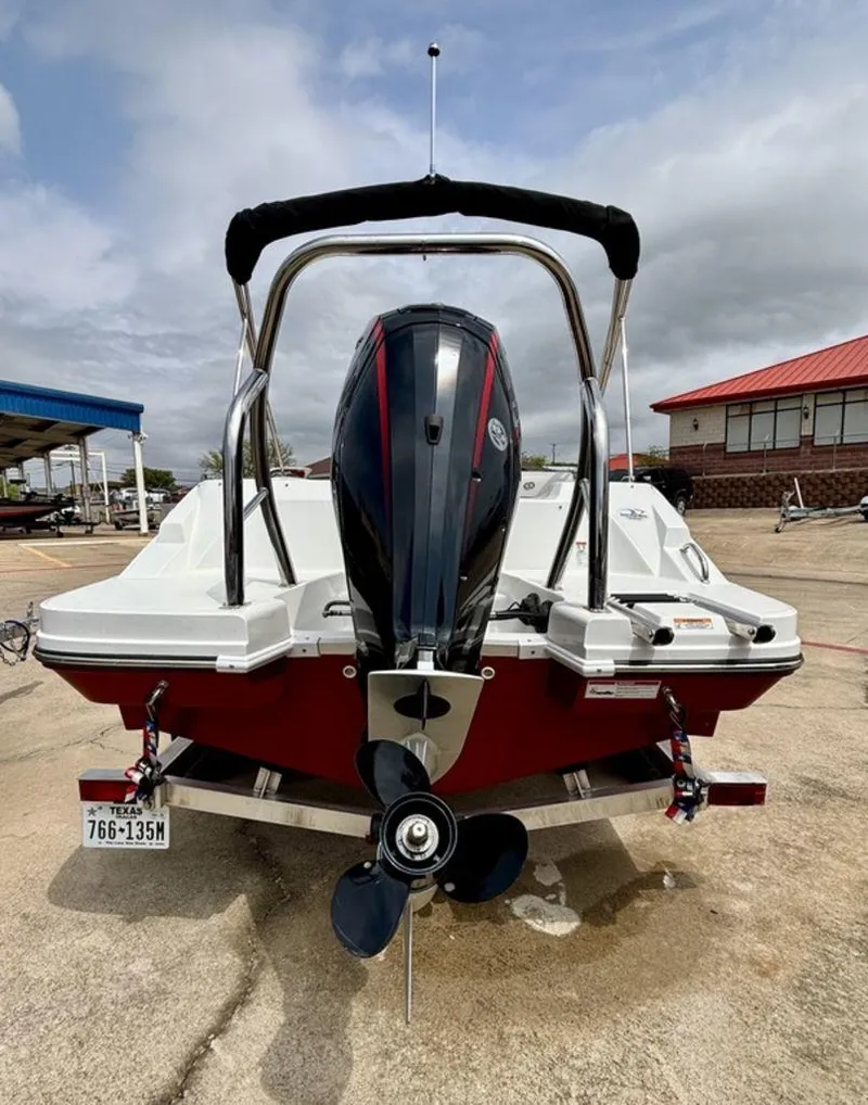 Slide: The Image of 2022 Hurricane SunDeck Sport 185 OB boat with outboard motor, parked on concrete. - 9