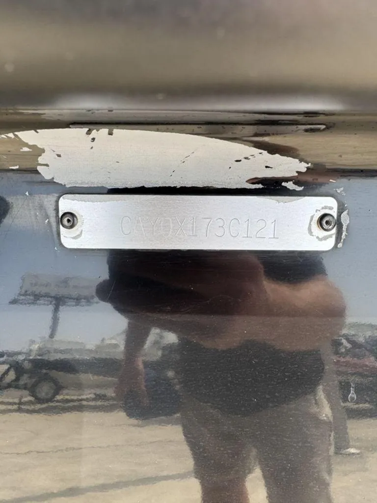 Slide: The Image of 2021 Caymas CX 20 boat hull identification number plate with reflection. - 11
