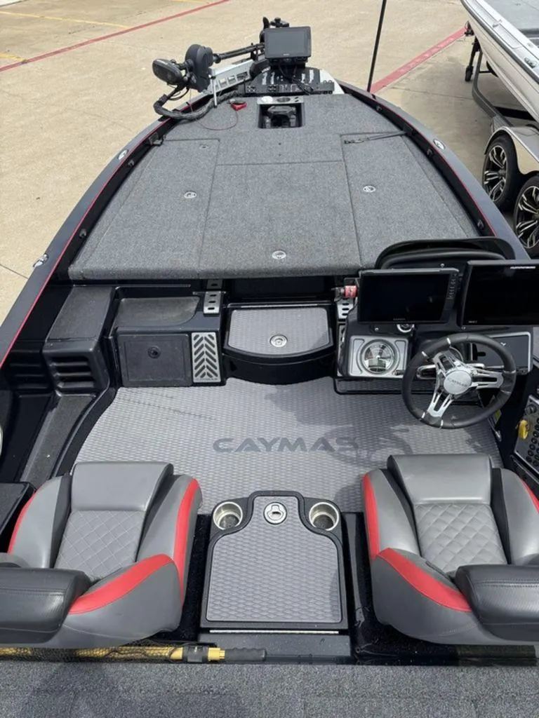 Slide: The Image of 2021 Caymas CX 20 boat interior with steering wheel, seats, and control panel. - 5