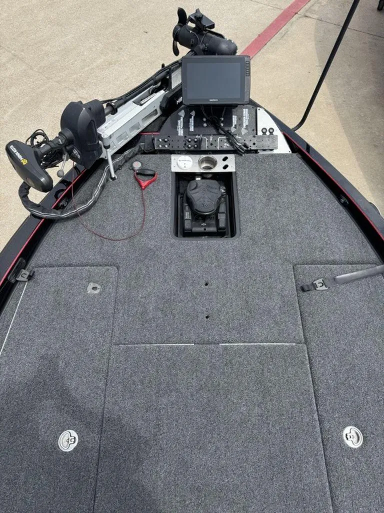 Slide: The Image of 2021 Caymas CX 20 boat deck with navigation equipment and carpeted surface. - 7