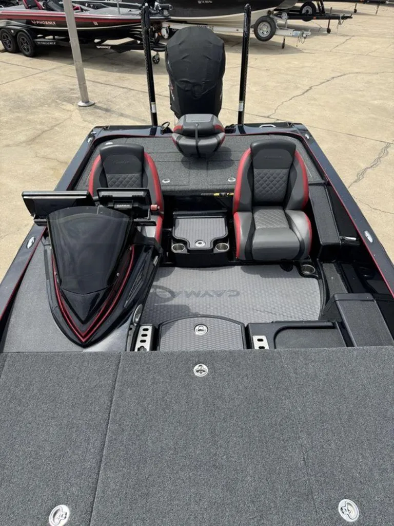 Slide: The Image of 2021 Caymas CX 20 boat interior with dual seats and dashboard view. - 8