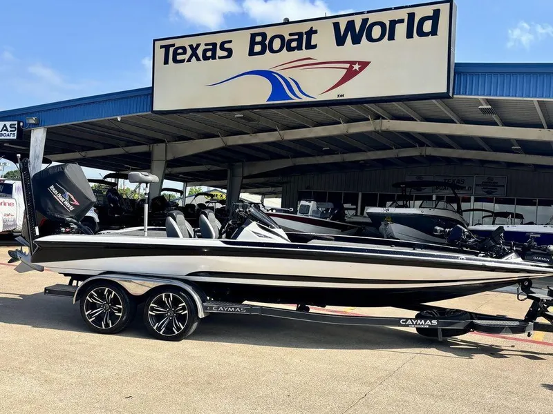 Slide: The Image of 2023 Caymas CX 21 boat at Texas Boat World dealership, side view. - 0