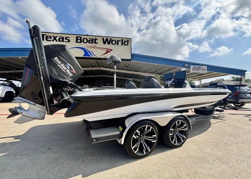 Slide: The Image of 2023 Caymas CX 21 boat at Texas Boat World dealership under a sunny sky. - 1