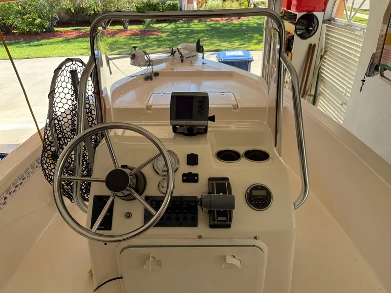 Slide: The Image of 2014 Bulls Bay 1700 boat console with steering wheel and navigation equipment. - 18