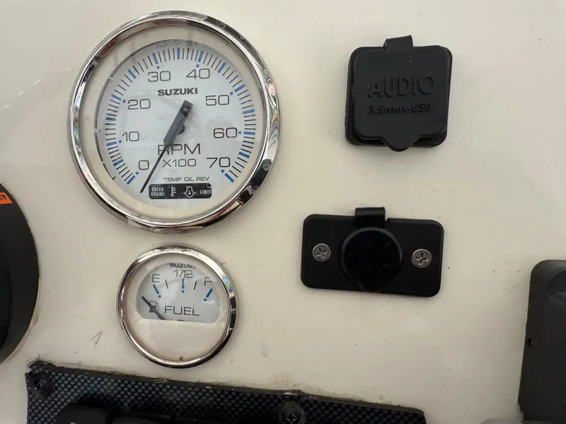 Slide: The Image of Dashboard of 2014 Bulls Bay 1700 boat with Suzuki RPM and fuel gauges. - 20