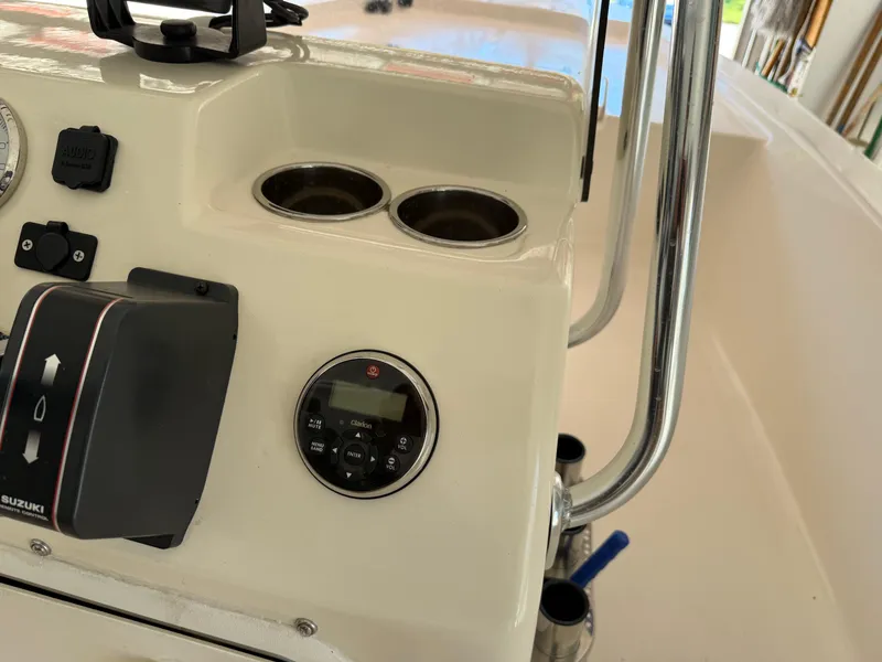 Slide: The Image of 2014 Bulls Bay 1700 boat console with controls and cup holders. - 22