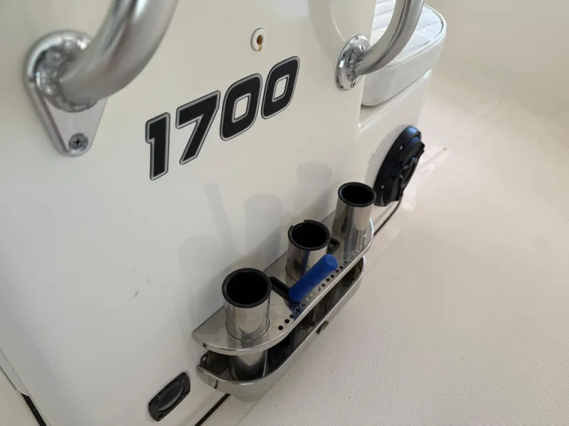 Slide: The Image of Bulls Bay 1700 boat interior, featuring rod holders and seating, 2014 model. - 24