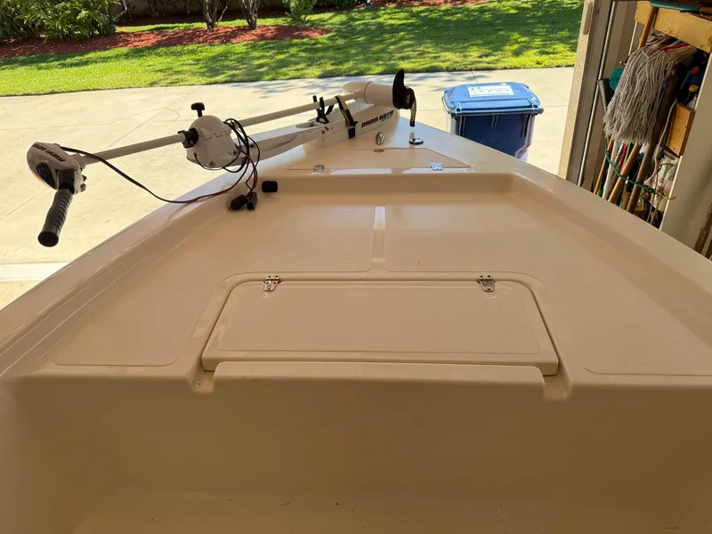 Slide: The Image of 2014 Bulls Bay 1700 boat interior with trolling motor in a garage setting. - 30