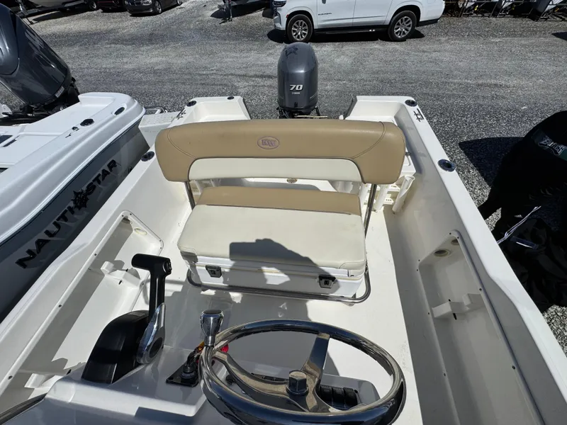 Slide: The Image of 2018 Key West 1720 Center Console boat interior with steering wheel and seating. - 4