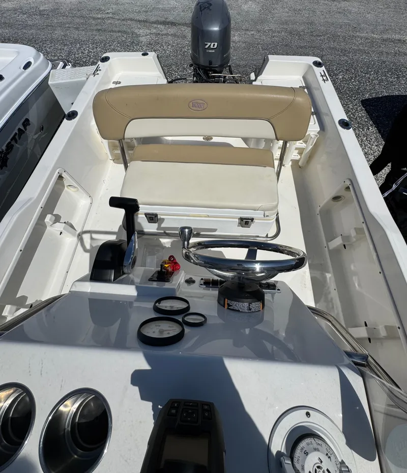 Slide: The Image of 2018 Key West 1720 Center Console boat interior with steering wheel and seating. - 5