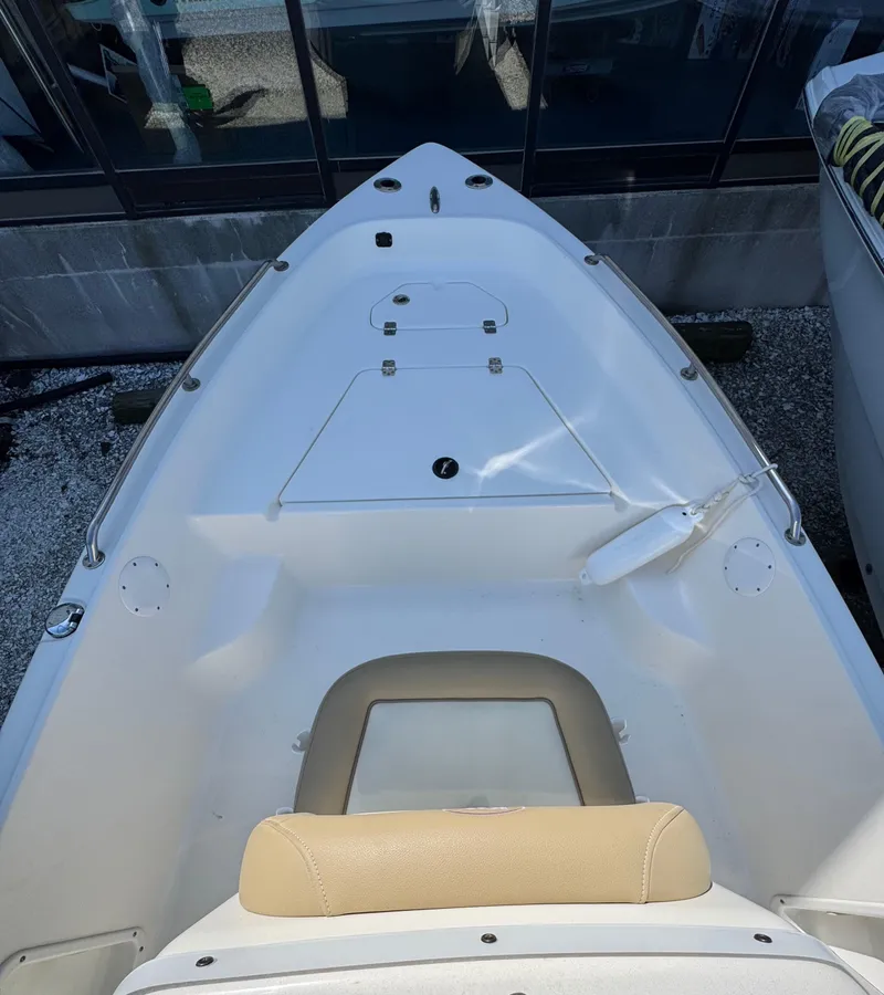 Slide: The Image of 2018 Key West 1720 Center Console boat interior with seating and storage compartments. - 7