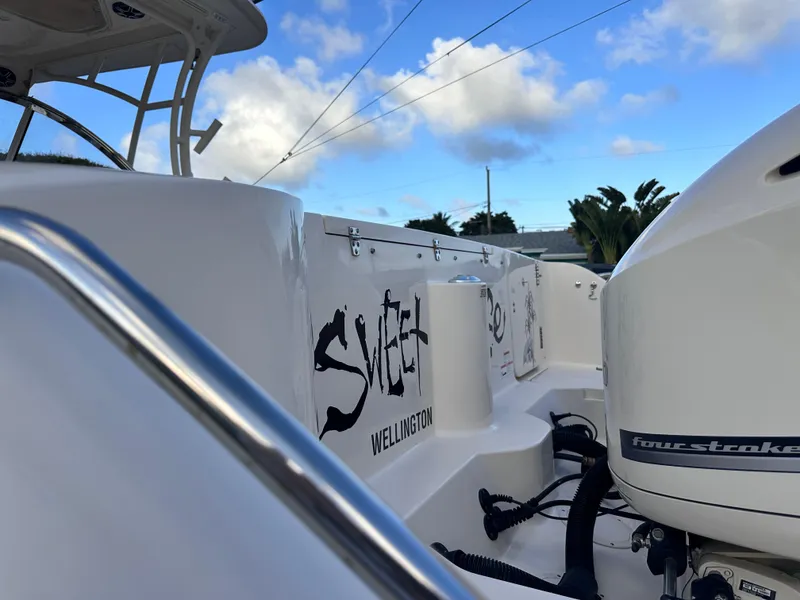 Slide: The Image of 2019 Grady-White Freedom 325 boat radar and light bar against a cloudy sky. - 17