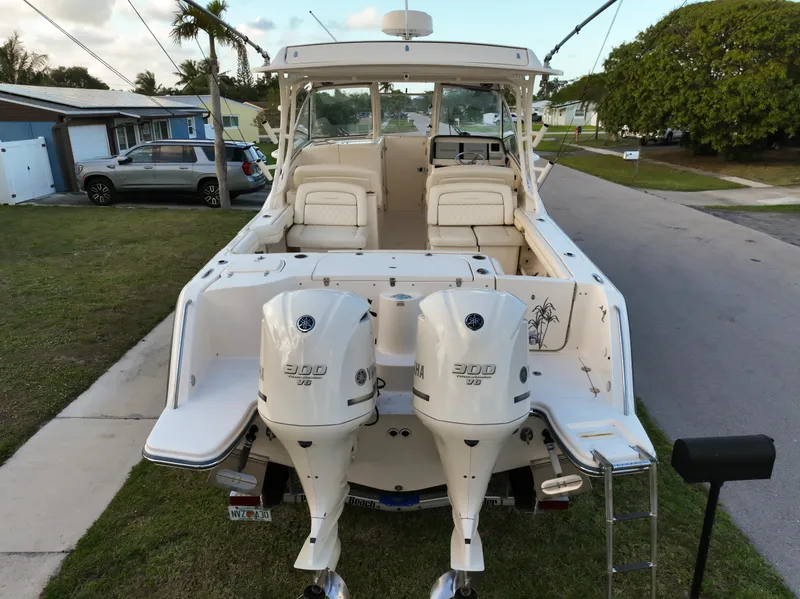 Slide: The Image of 2019 Grady-White Freedom 325 boat seat with white upholstery and diamond stitching. - 23