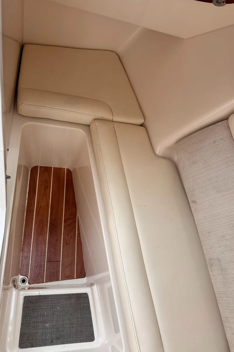 Slide: The Image of 2019 Grady-White Freedom 325 boat with dual Yamaha 300 engines, parked on a residential street. - 27