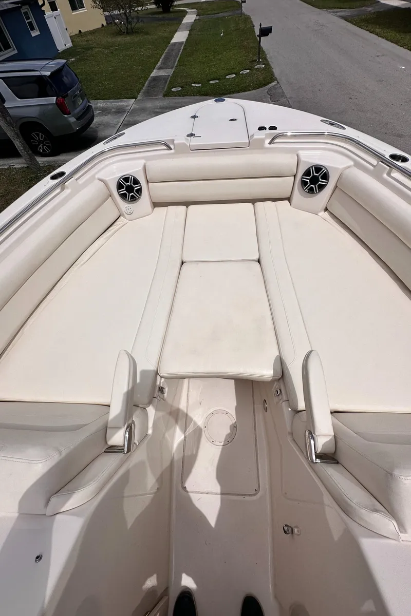 Slide: The Image of 2019 Grady-White Freedom 325 interior with beige seating and wood flooring. - 34