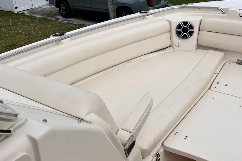 Slide: The Image of 2019 Grady-White Freedom 325 boat interior with compact bathroom and wooden flooring. - 36