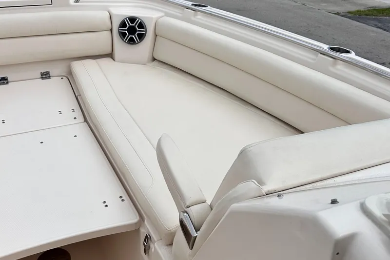Slide: The Image of 2019 Grady-White Freedom 325 boat interior with white cushioned seating. - 41