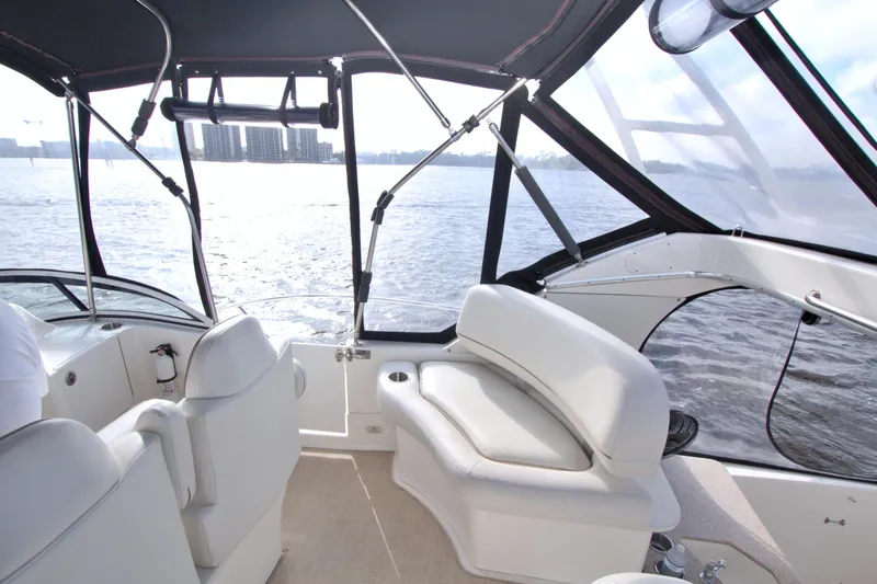 Slide: The Image of 2006 Silverton 39 Motor Yacht interior with white seating and water view. - 26
