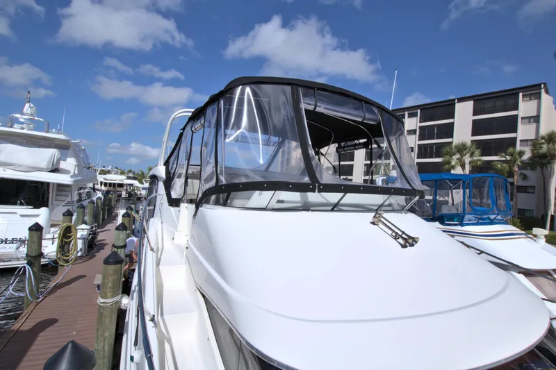 Slide: The Image of 2006 Silverton 39 Motor Yacht docked under a clear blue sky. - 30