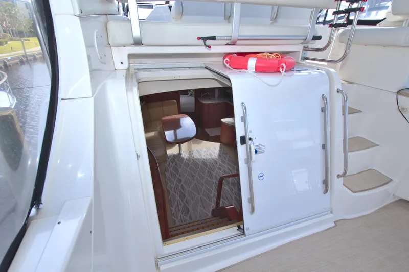 Slide: The Image of 2006 Silverton 39 Motor Yacht interior entrance with open door and visible seating area. - 37