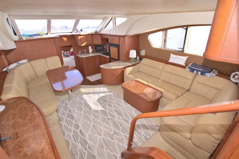 Slide: The Image of Luxurious interior of 2006 Silverton 39 Motor Yacht with plush seating and elegant wood finishes. - 38