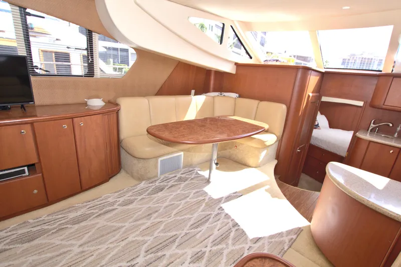 Slide: The Image of Luxurious interior of 2006 Silverton 39 Motor Yacht with elegant seating and dining area. - 41