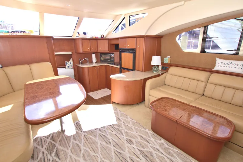 Slide: The Image of Luxurious interior of a 2006 Silverton 39 Motor Yacht with elegant furnishings and ample natural light. - 42