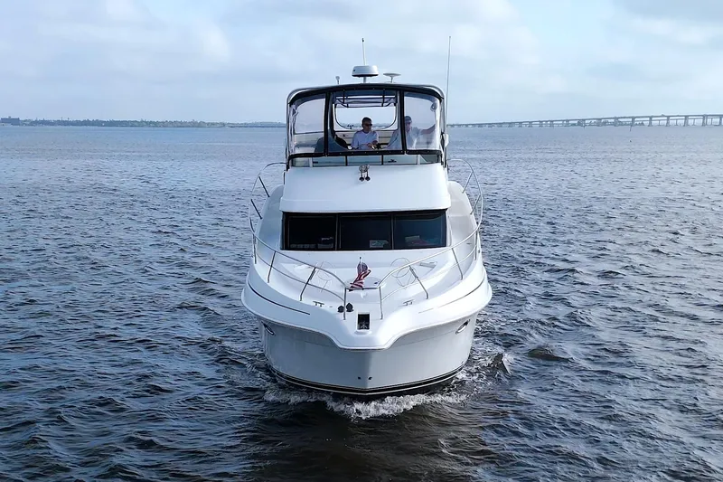 Slide: The Image of 2006 Silverton 39 Motor Yacht cruising on open water. - 5