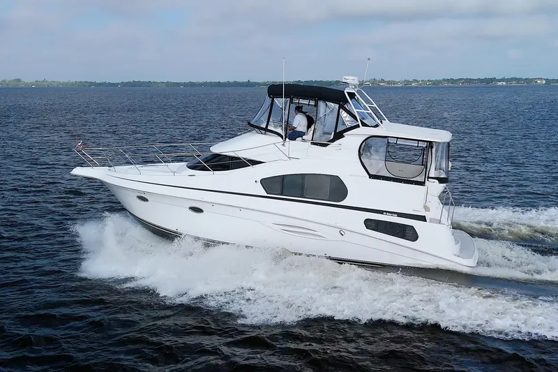 Slide: The Image of 2006 Silverton 39 Motor Yacht cruising on open water. - 8