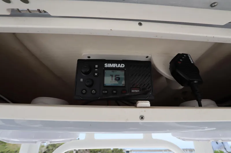 Slide: The Image of Simrad marine radio installed on 2021 Robalo R242 Explorer boat. - 18