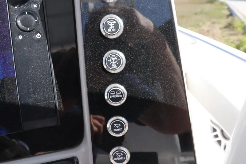 Slide: The Image of Control panel of 2021 Robalo R242 Explorer boat with labeled buttons. - 20