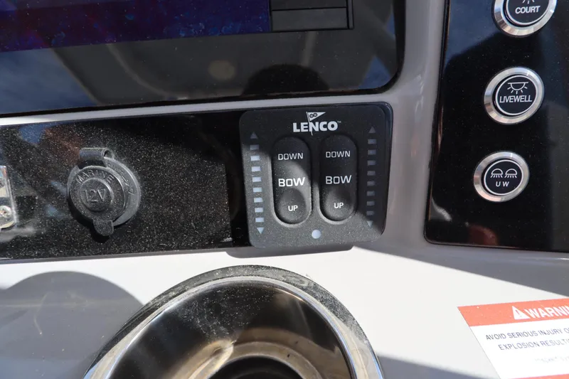 Slide: The Image of Control panel of a 2021 Robalo R242 Explorer boat with Lenco trim tab switches. - 21