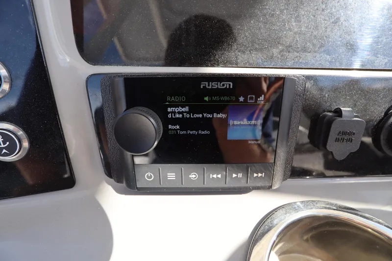 Slide: The Image of Fusion radio display on 2021 Robalo R242 Explorer boat dashboard. - 24